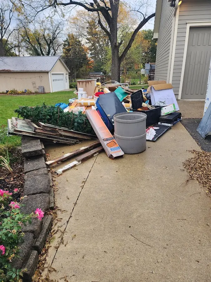 Dumpster being loaded with debris for 3 Yard Dumpster Rental in Moundsville